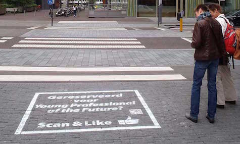 This chalk message on the sidewalk in Amsterdam even has a QR code! Image courtesy of Green Graffiti. 
